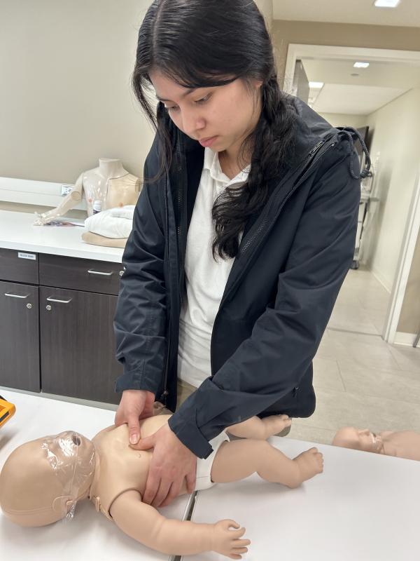 Sussex Academy student Melanie Felipe-Ramirez performs child CPR on a mannequin.